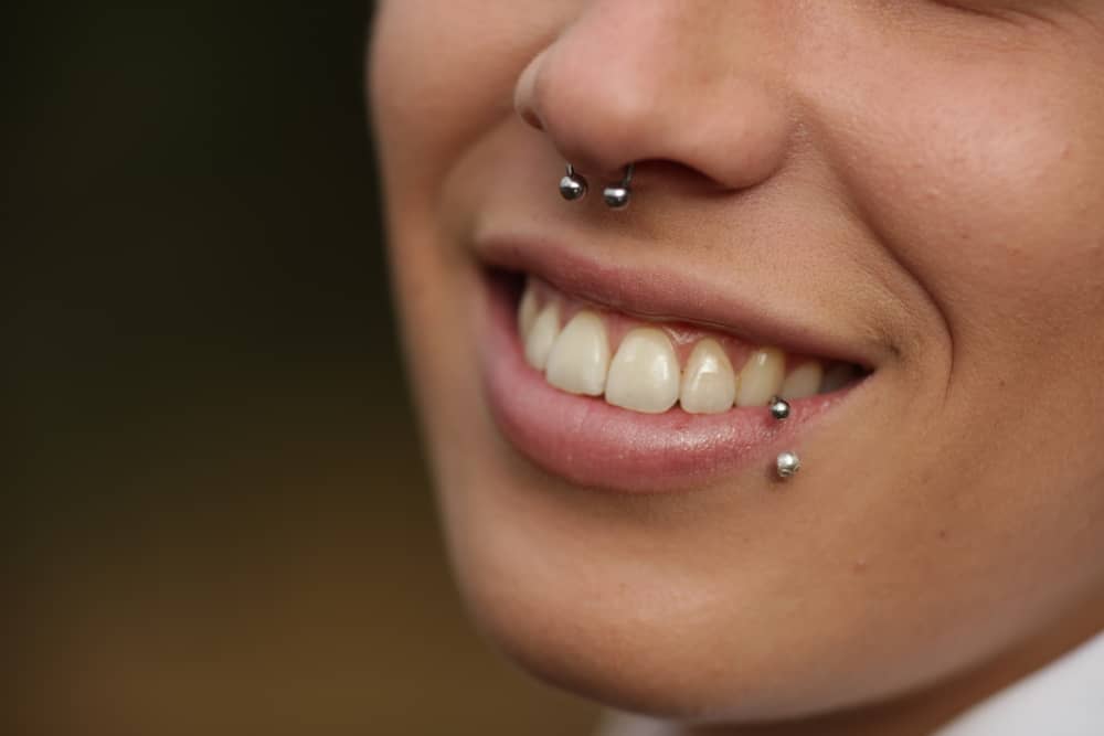 smiling woman with piercings