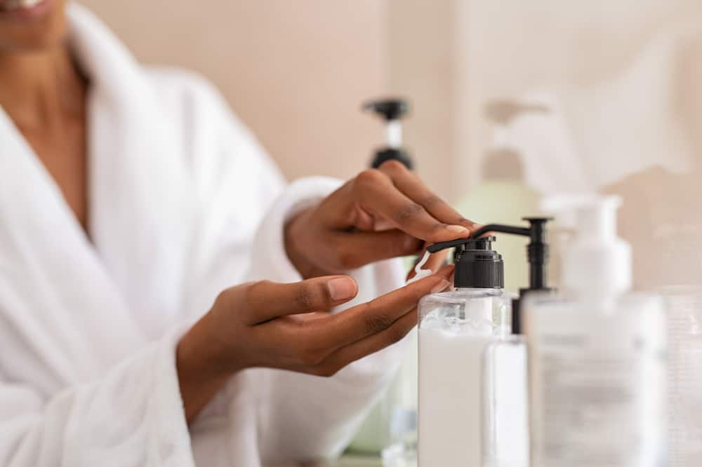 woman dispensing skin cream