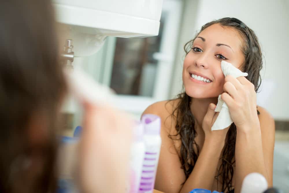 woman removing makeup