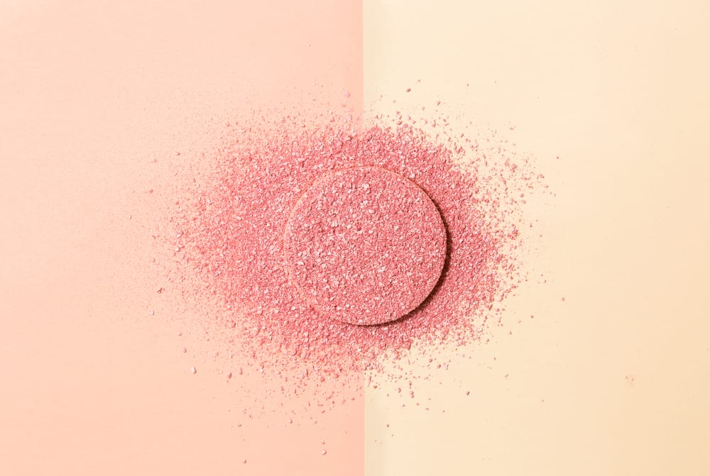 powdered blush on a sponge