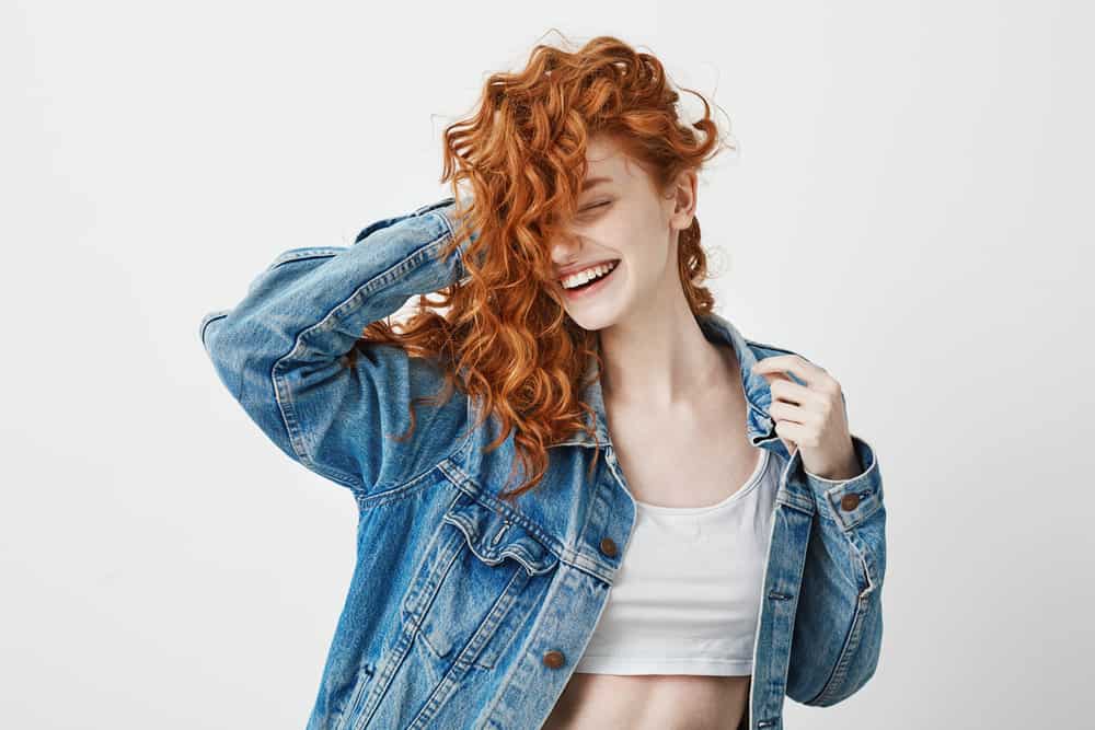 smiling girl with curly hair