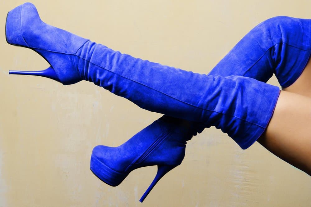 someone wearing blue suede platform boots