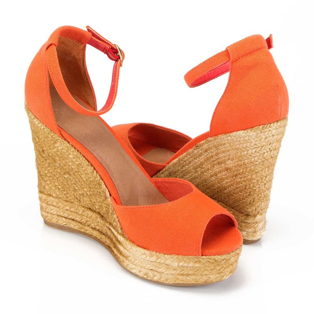 orange espadrille wedges on a white background