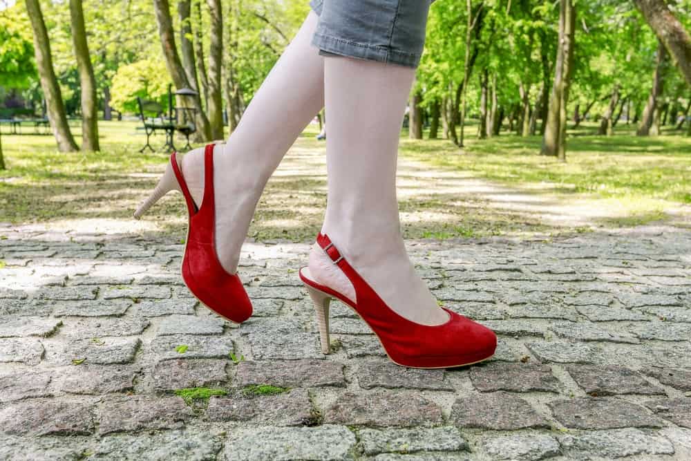 someone wearing red slingback heels