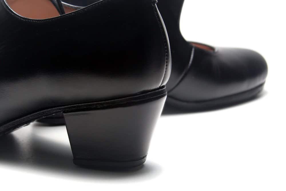 black shiny flamenco shoes on a white background