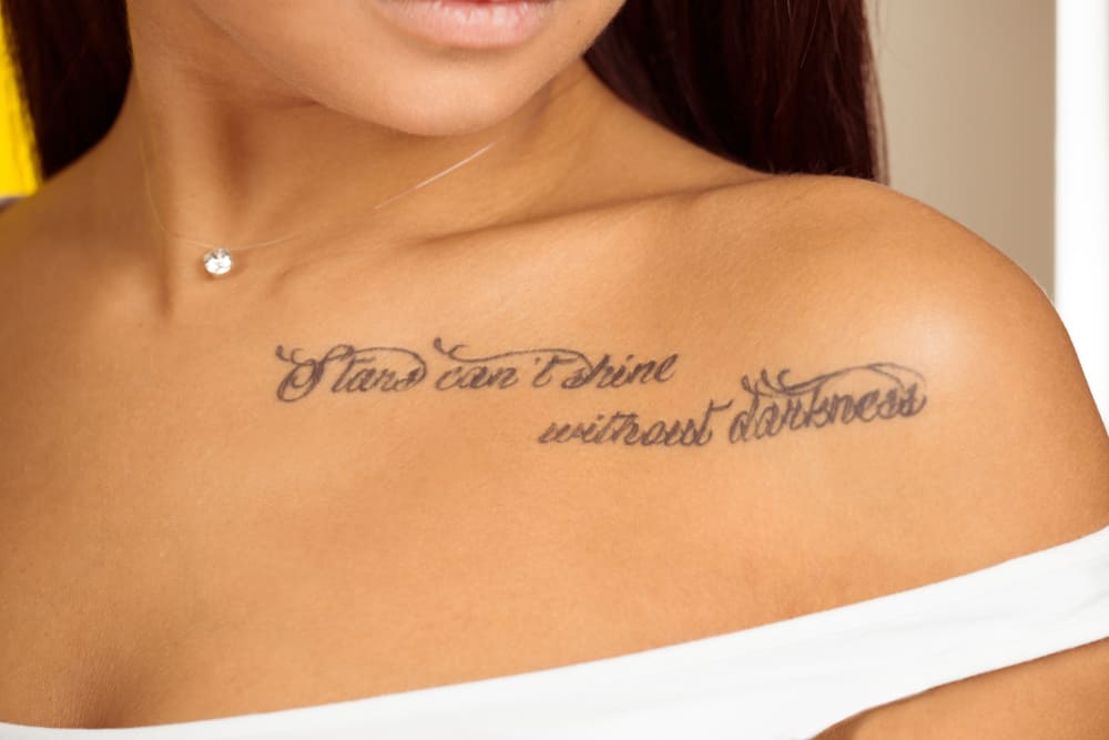 woman with lettering tattoo