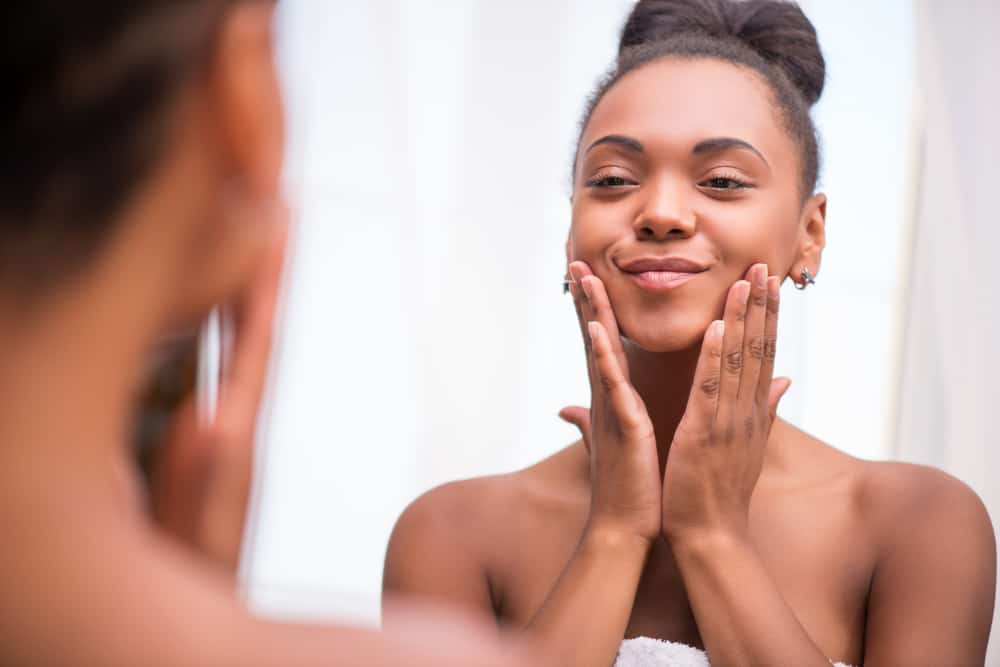 woman smiling in the mirror