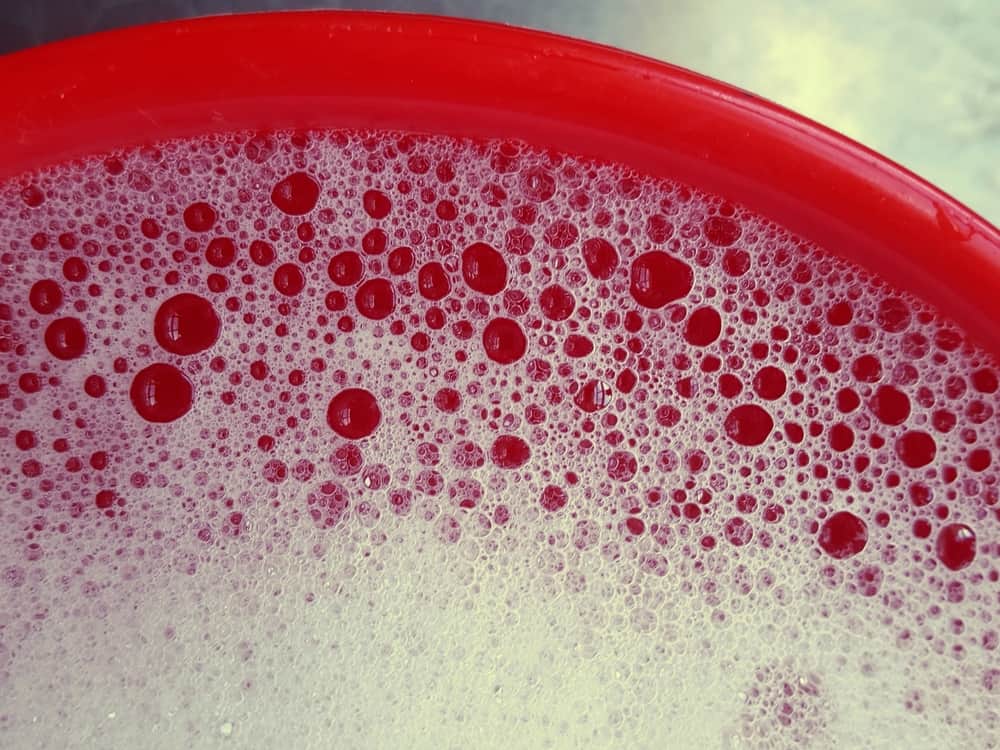 soapy water in red bucket