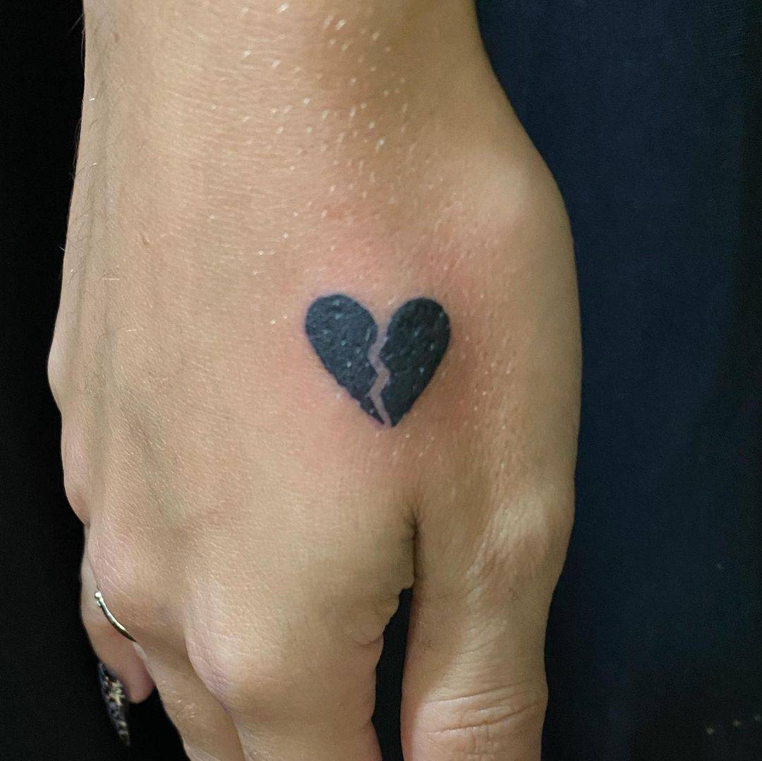 tatt of broken heart with heartbeat line