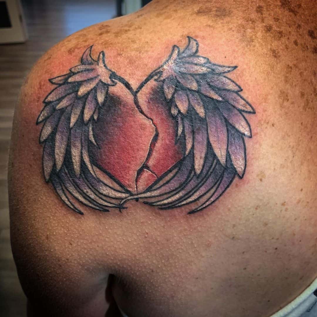 tatt of broken heart with heartbeat line