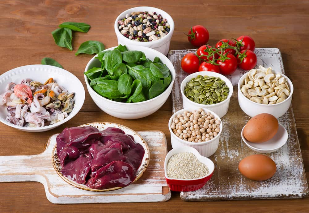 iron-rich foods including nuts, legumes, meat, and vegetables