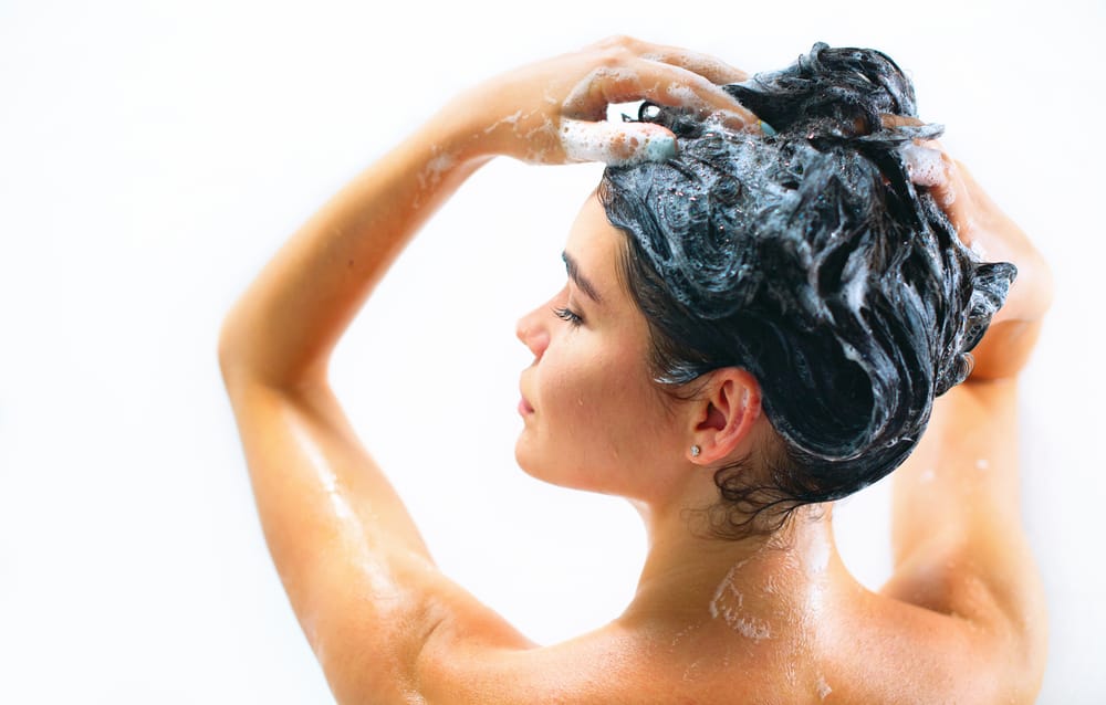 woman moisturizing hair