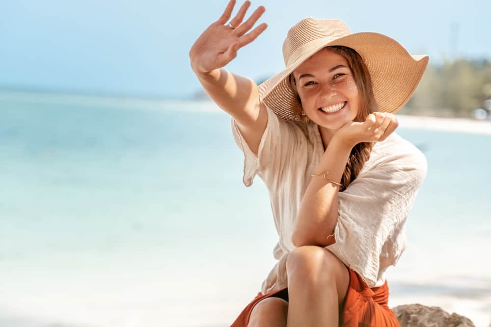 woman protects hair from sun