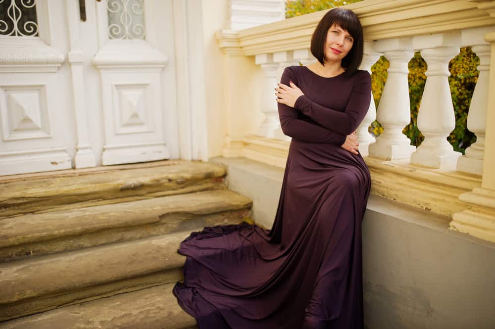  woman in dark purple dress