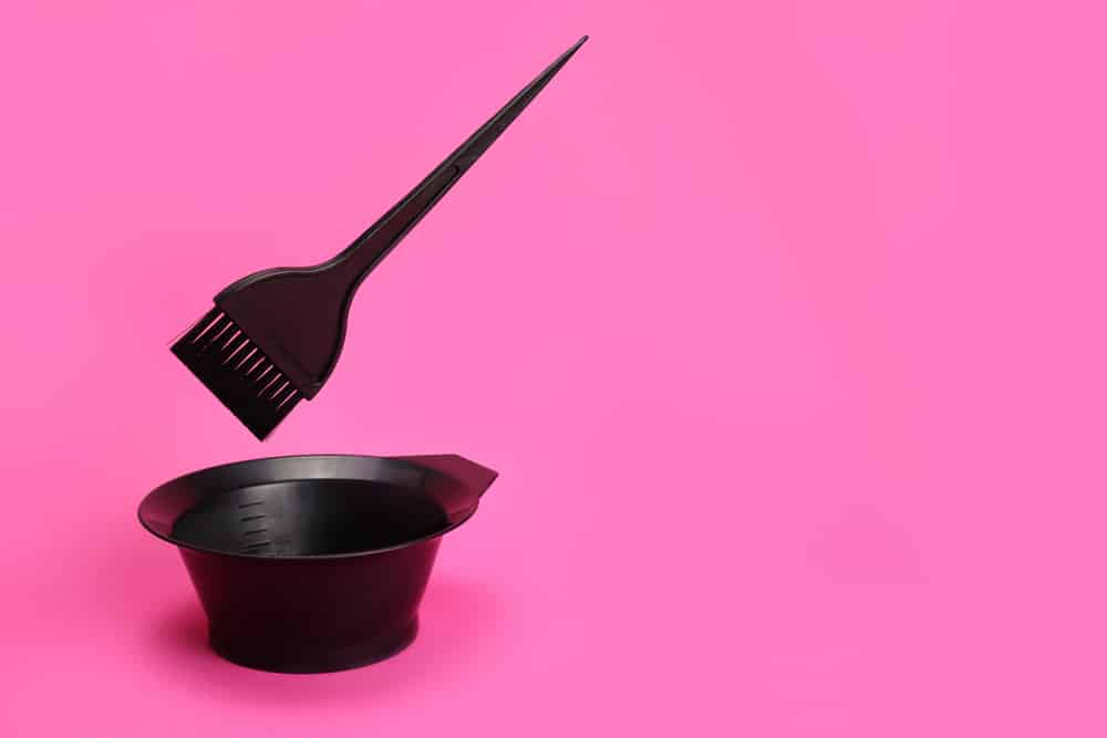 a bowl and brush for applying hair dye