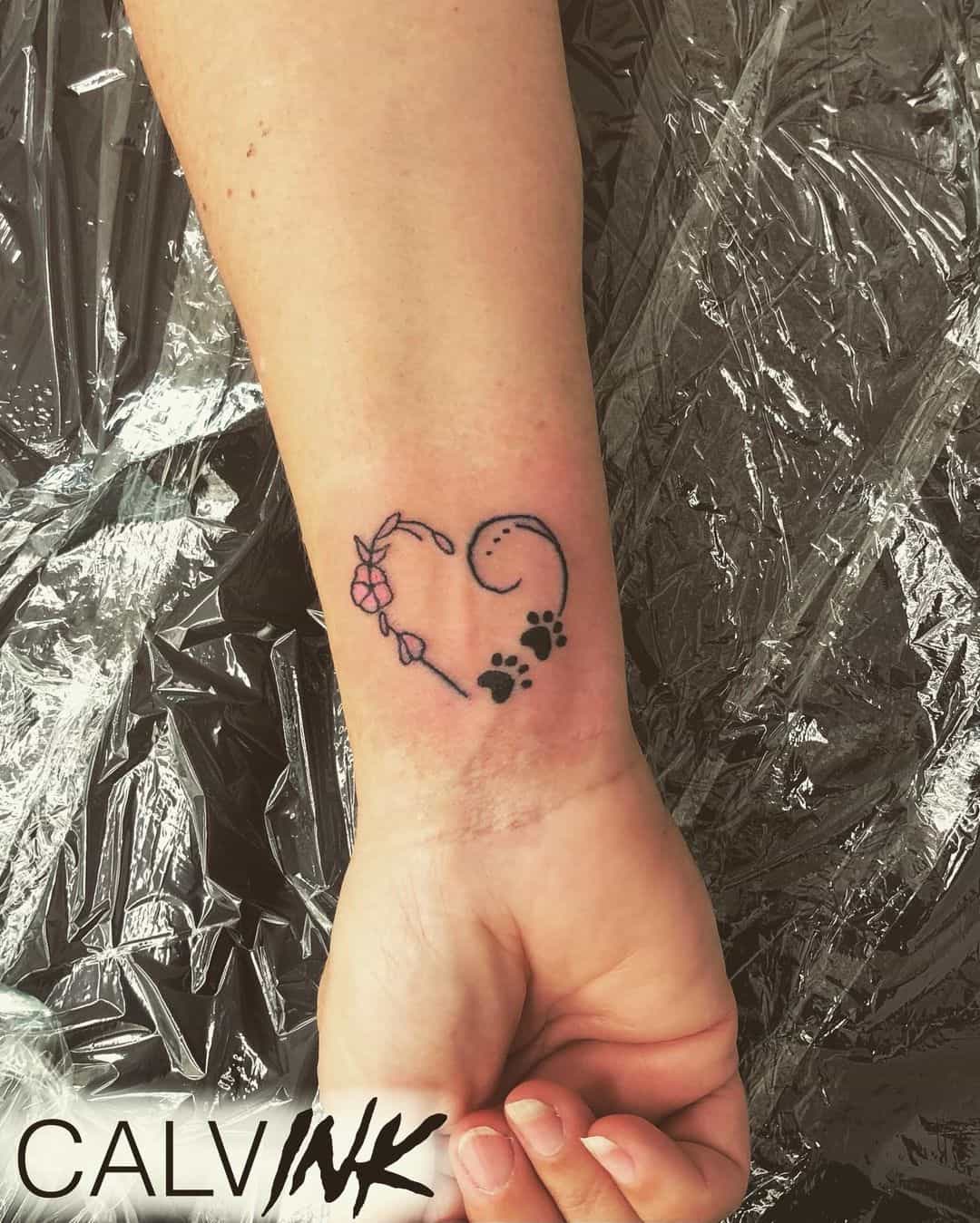 paw print heart tattoo