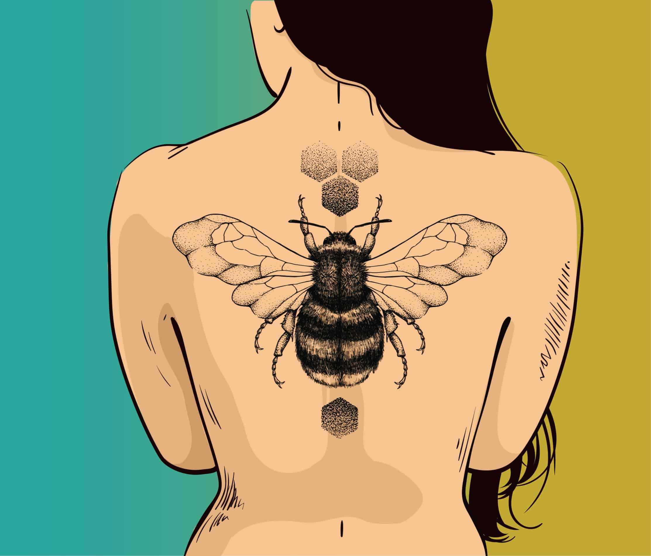 bee tattoo on woman’s back