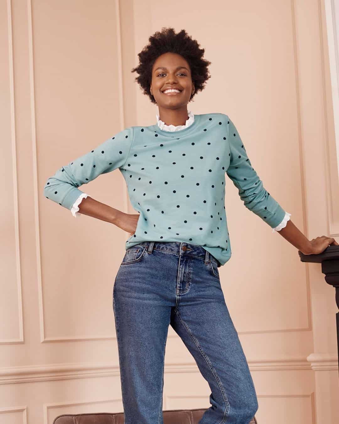 Woman in polka dot sweatshirt