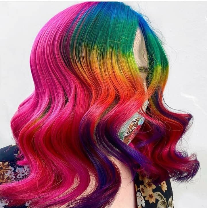 Woman with rainbow hair dye gradient