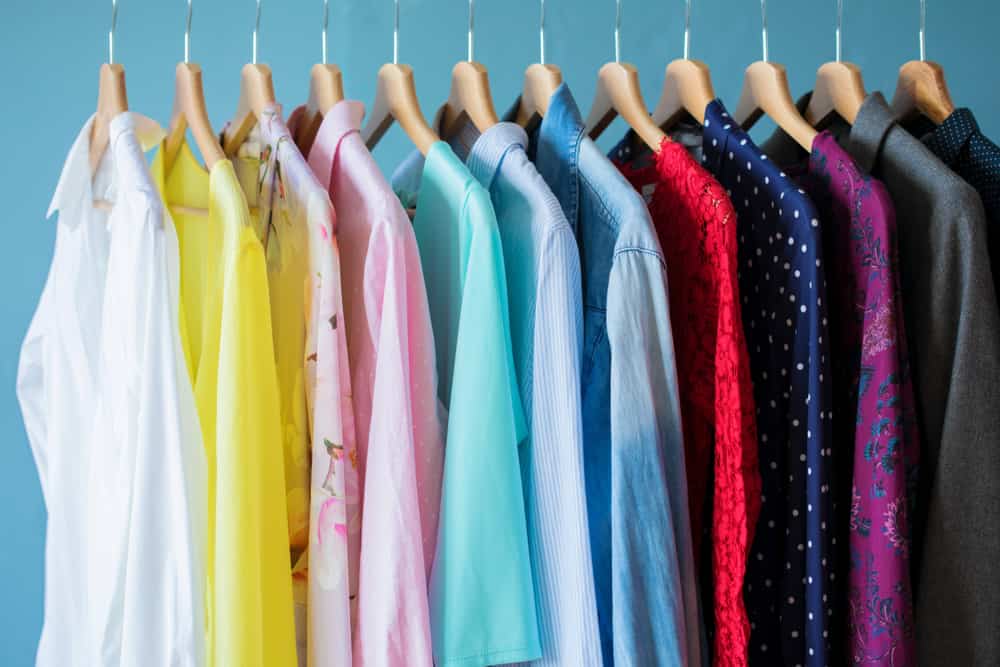 colorful blouses hanging on a rack