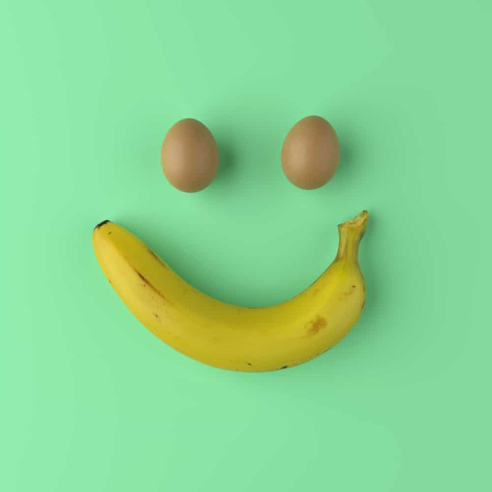 eggs and banana forming smiley face