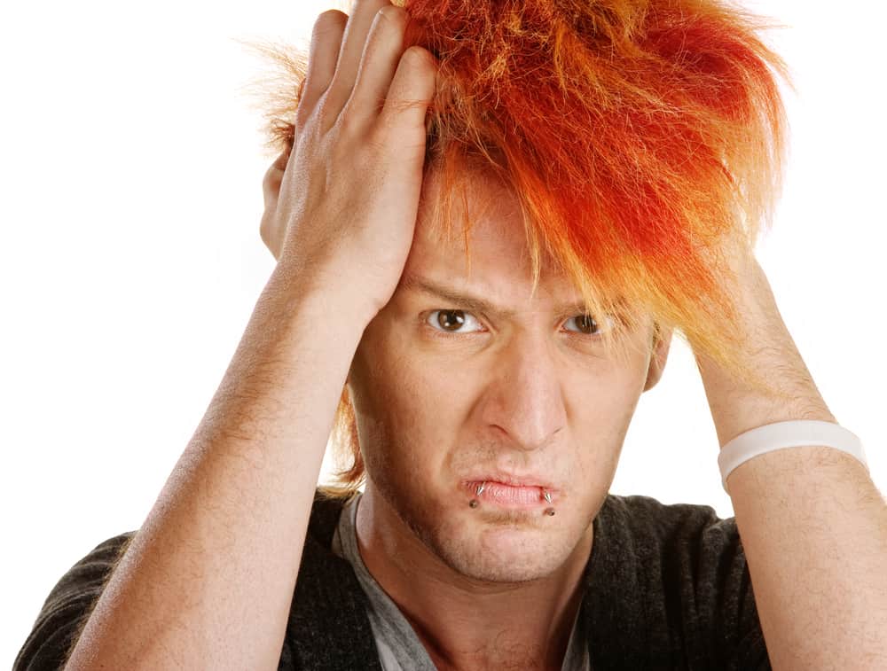 unhappy man with orange hair