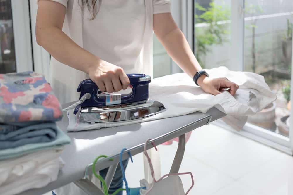 woman ironing clothes