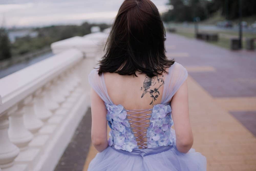 woman with a bird tattoo