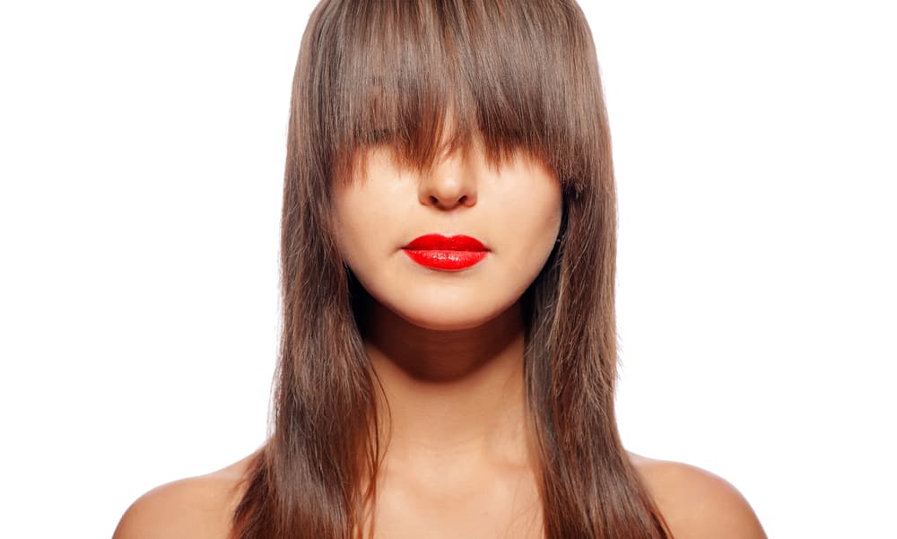 woman with grown out bangs