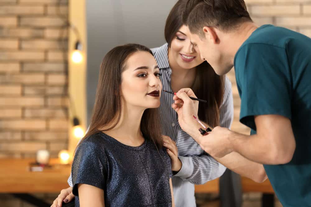 makeup school student applying makeup