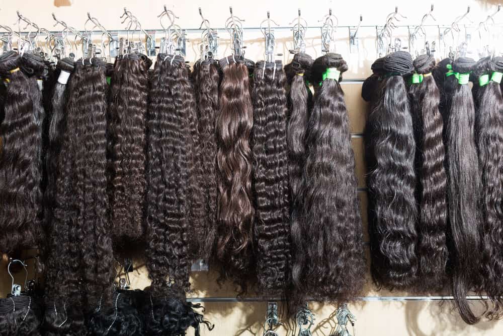 selection of hair extensions in a salon