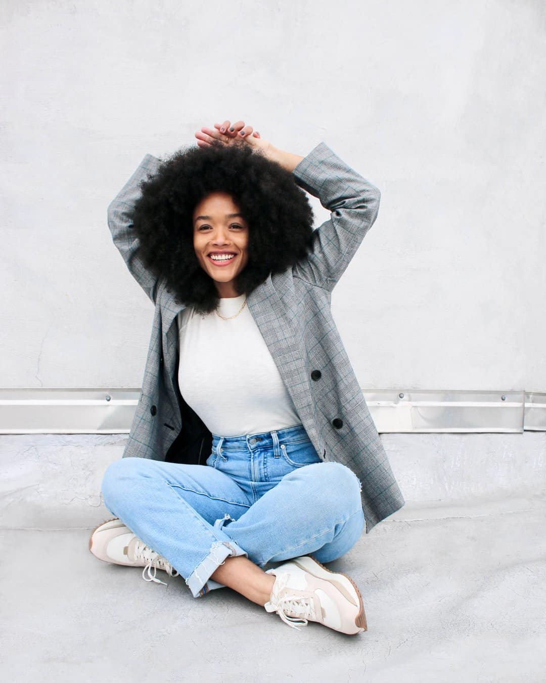 woman in madewell jeans and blazer