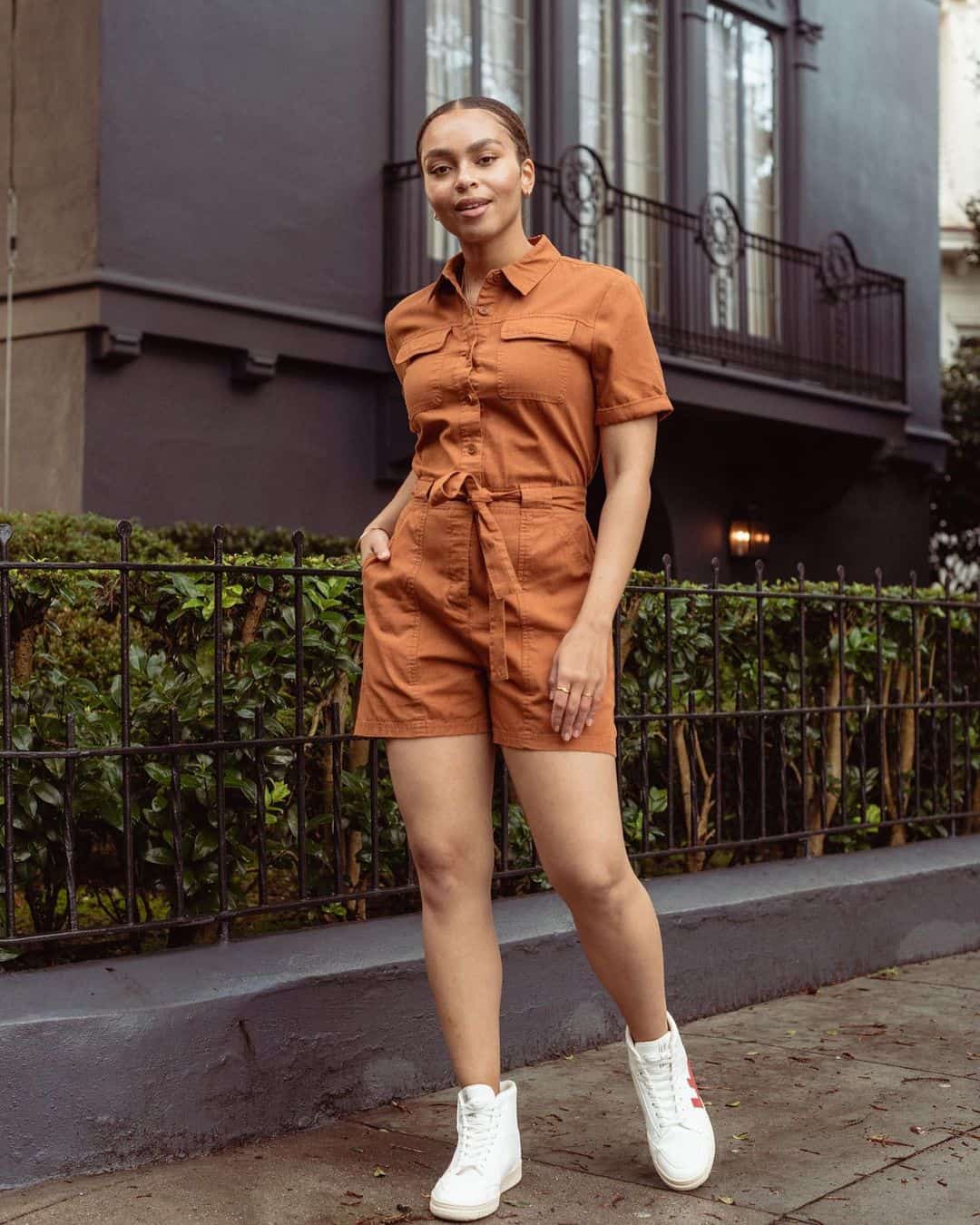 woman in orange romper