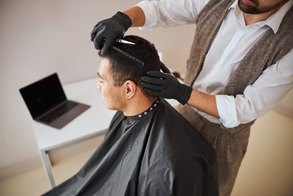 man receiving a haircut