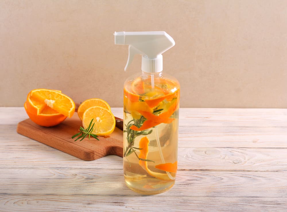 spray bottle of water and orange peels