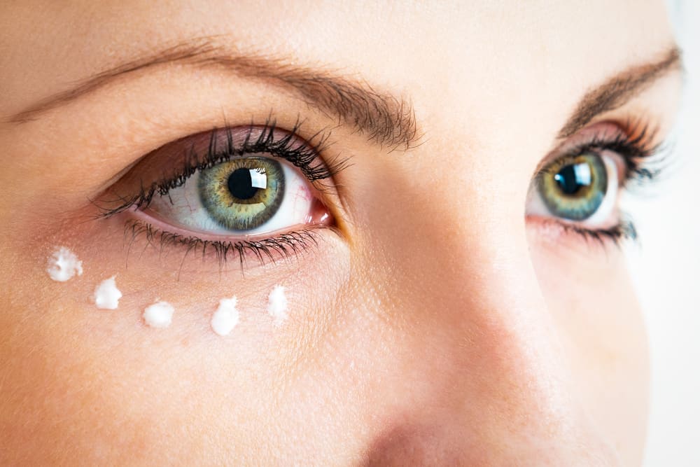 woman with dotted eye cream