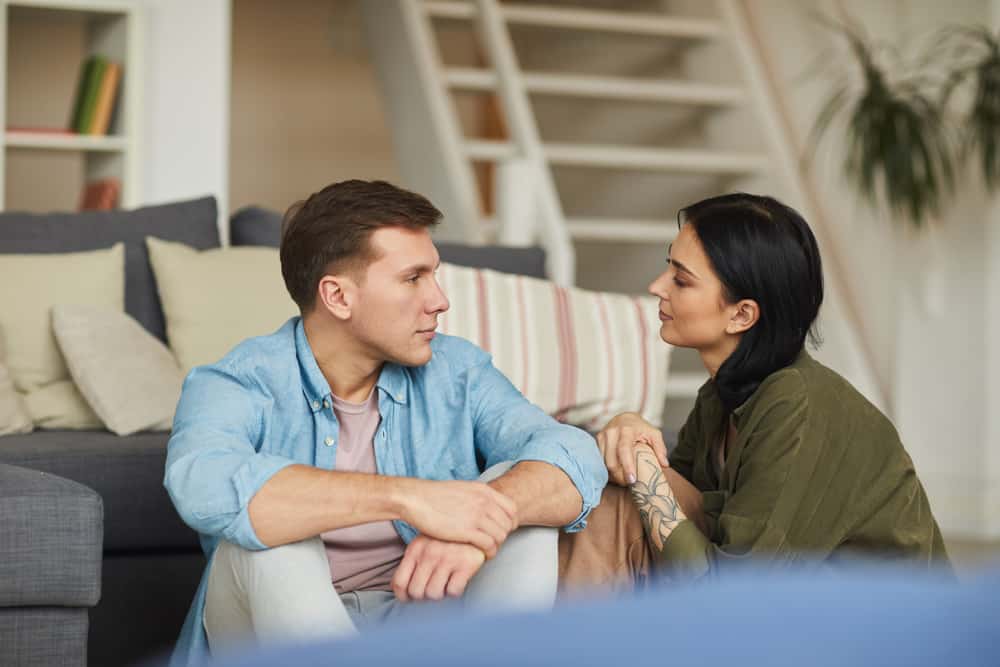 young couple having a serious conversation together