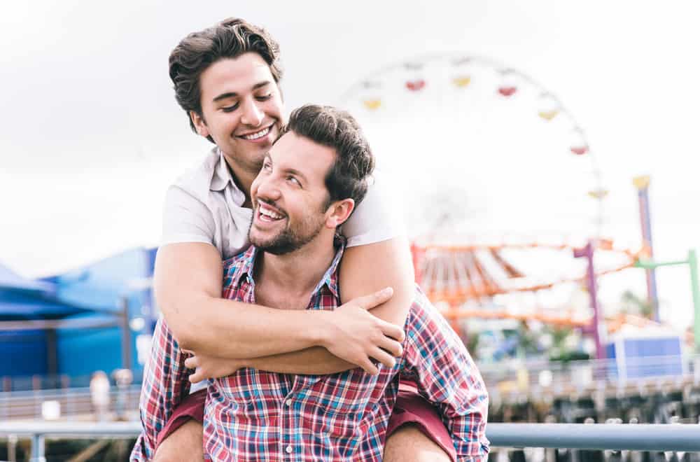 happy couple together on pier