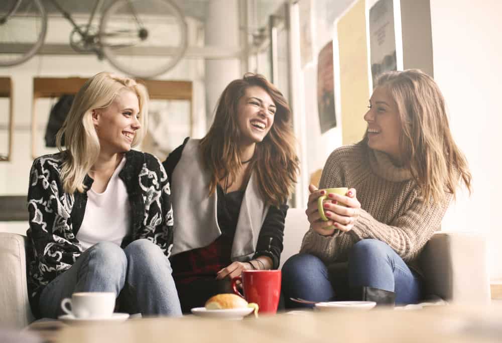 three women talking and laughing