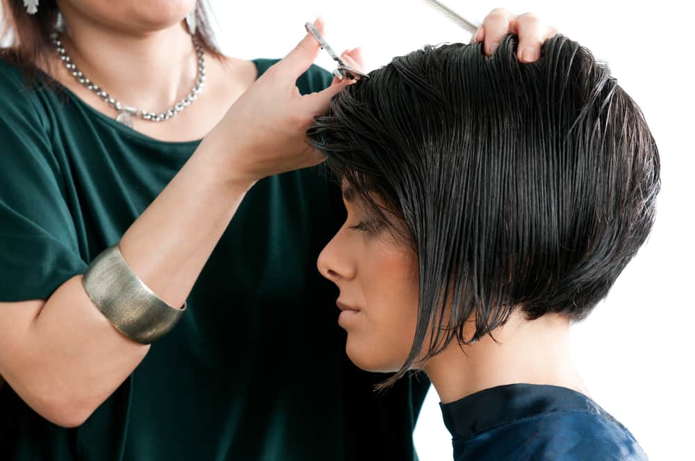 woman getting short haircut