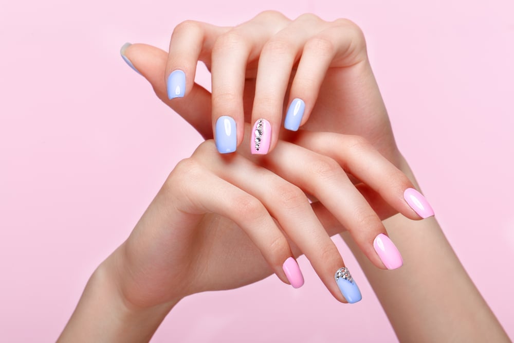 blue and pink manicured hands