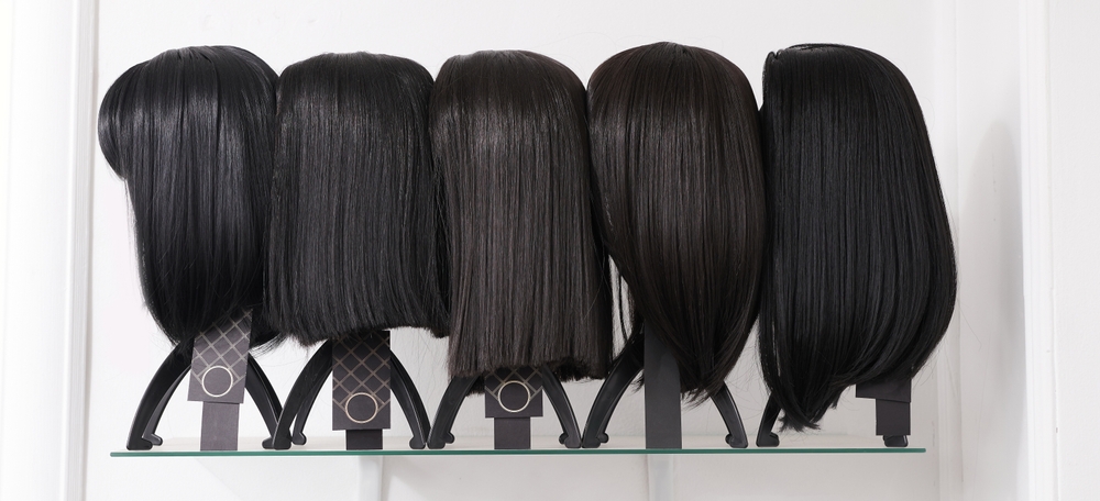 wigs displayed on wig stand